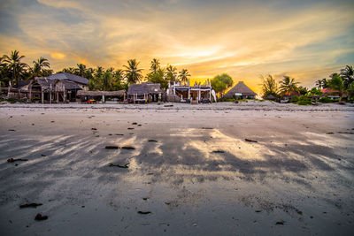 Scenic view of beach against sky during sunset