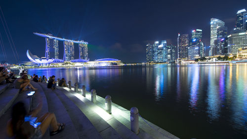 Illuminated city buildings at night