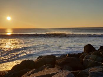 Scenic view of sea against sky during sunset