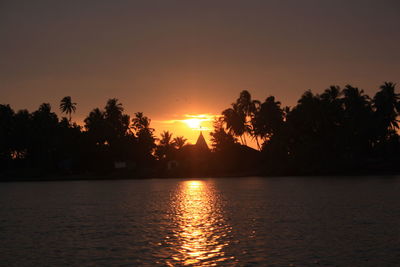 Scenic view of sunset over river