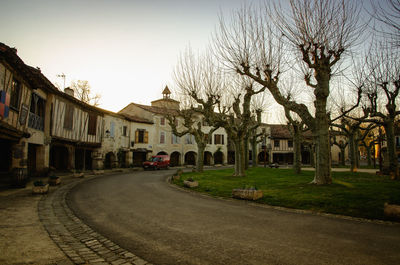 Street amidst buildings against sky