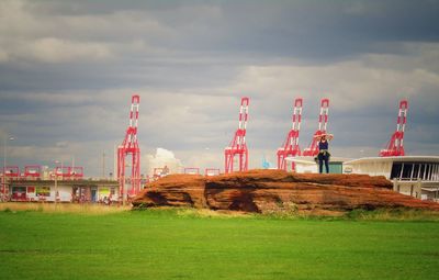 Built structure on field against sky