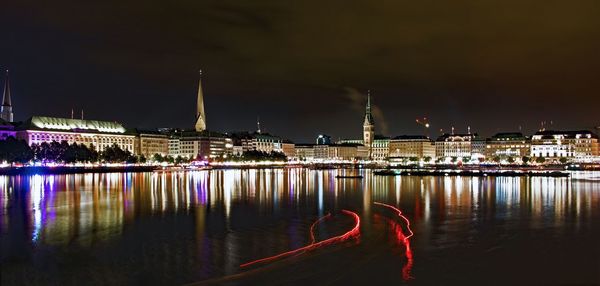 Illuminated city at waterfront