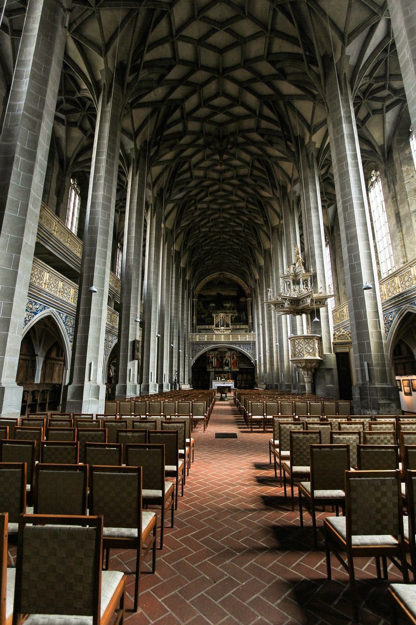 indoors, architecture, built structure, arch, ceiling, the way forward, corridor, architectural column, interior, diminishing perspective, in a row, empty, colonnade, history, column, place of worship, religion, flooring, architectural feature, vanishing point