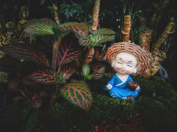 Cute boy sitting in park