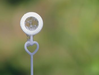 Close-up of metal pole against blurred background