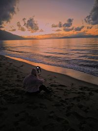 Scenic view of beach against sky during sunset