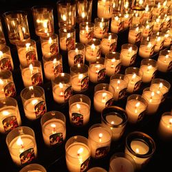 High angle view of lit candles in temple