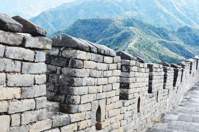 View of stone wall with mountain in background