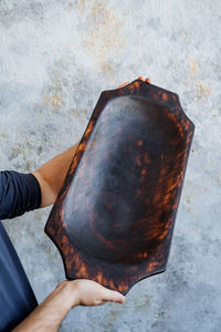 Midsection of man working on wood