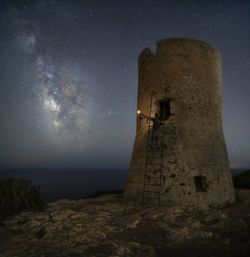 Scenic view of sea against sky at night