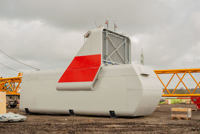 Ship moored on beach against sky