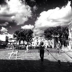 Silhouette of woman against cloudy sky