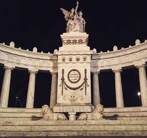 Low angle view of historical building at night