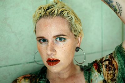 Close-up portrait of young woman taking bath