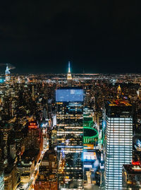 Illuminated buildings in city at night