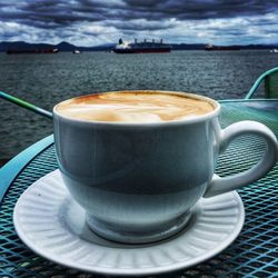 Close-up of coffee cup on table