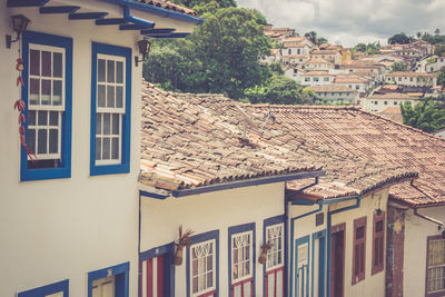 Houses in town against sky