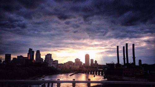 City skyline against cloudy sky