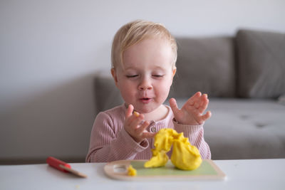 Portrait of cute girl eating food