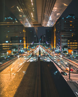 High angle view of illuminated railroad tracks at night