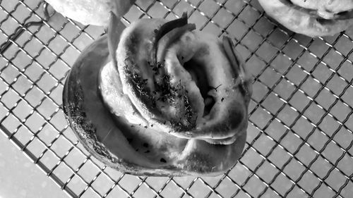 High angle view of ice cream in chainlink fence