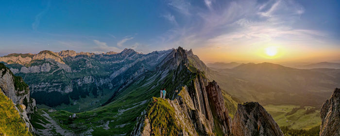 Panoramic view of mountains against sky during sunset