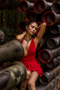Portrait of young woman standing in industry