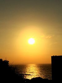 Scenic view of sea at sunset