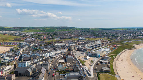 High angle view of buildings in city against sky