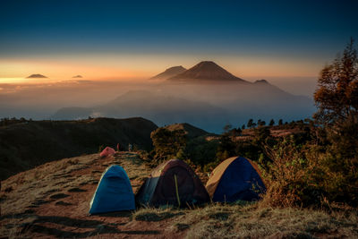 Scenic view of mountains against sky during sunset