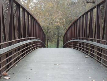 Footbridge leading towards trees