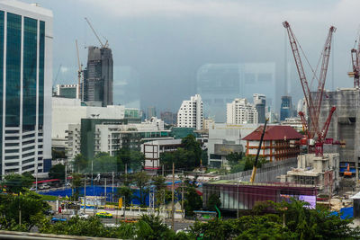 Modern buildings in city against sky