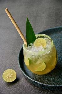 Mocktail of sugarcane and lime with bamboo straw