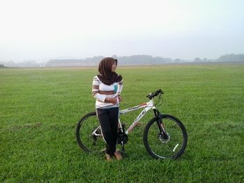 Full length of man standing on grassy field