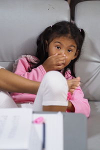 Portrait of cute girl at home