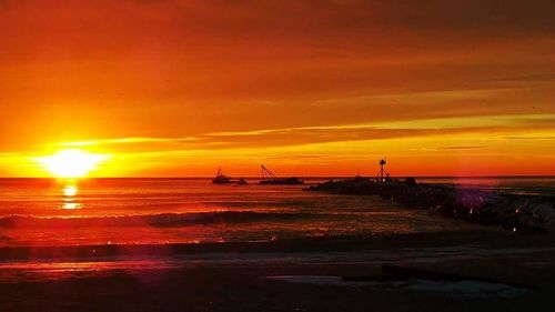 Scenic view of sea at sunset