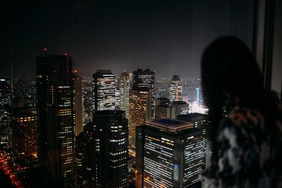 Aerial view of city lit up at night