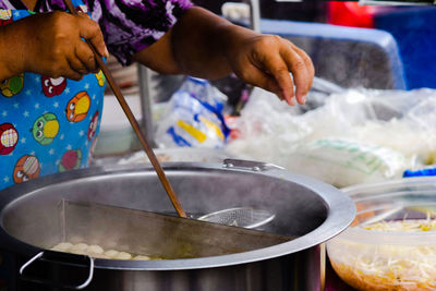 Close-up of person preparing food