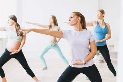 Women exercising in yoga studio