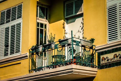 Street light by building in city