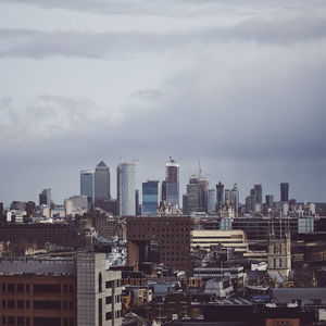 Modern buildings in city against sky