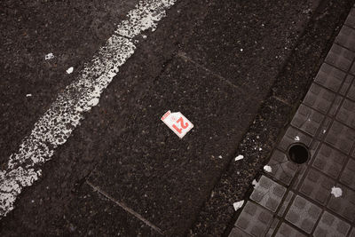 High angle view of arrow sign on street