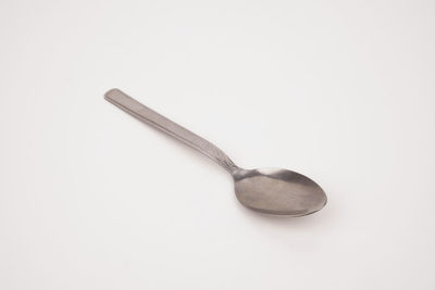 High angle view of fork over white background