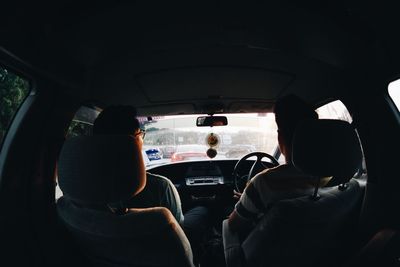 Rear view of friends in car