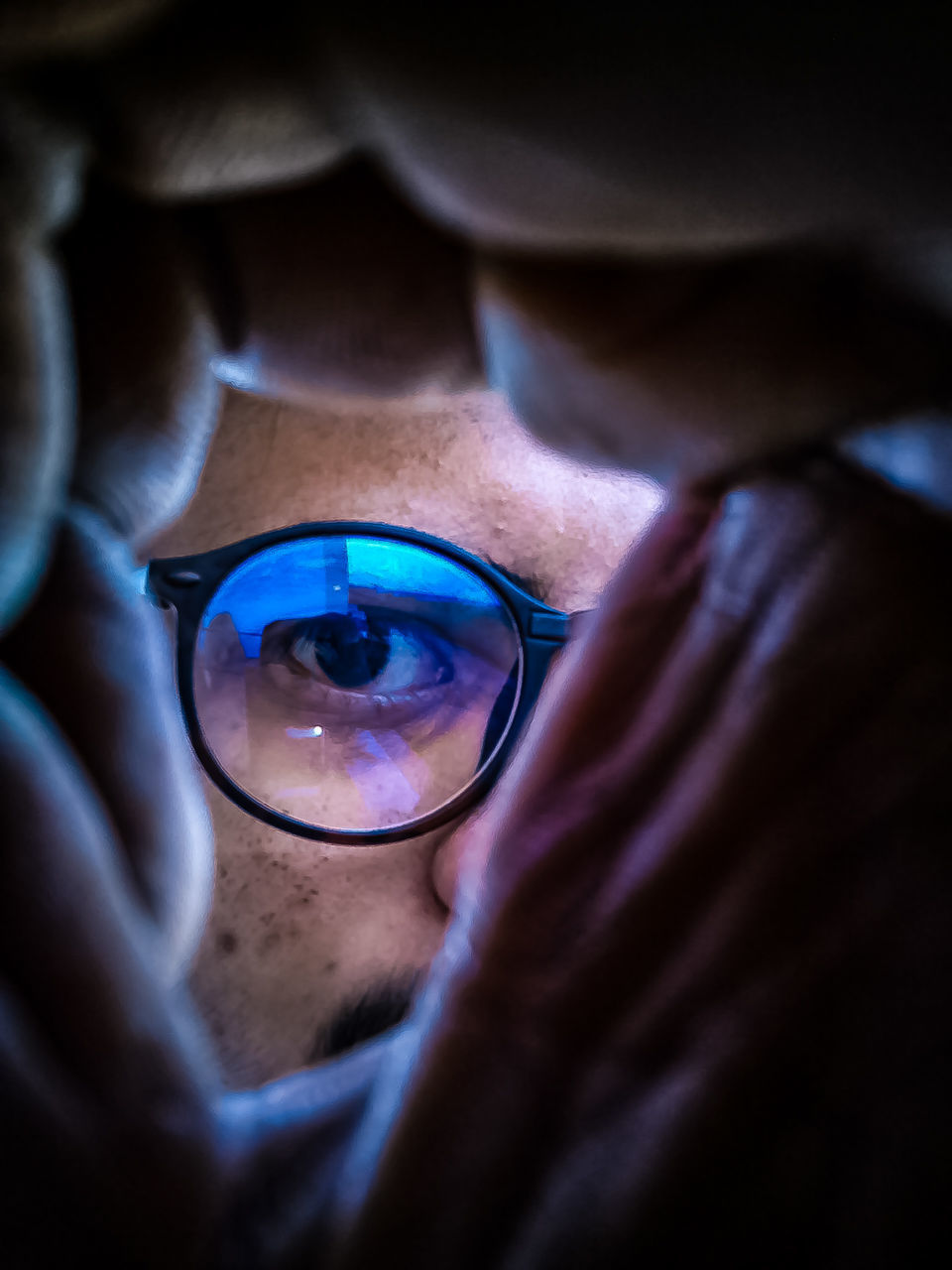 Close-up portrait of man wearing eyeglasses