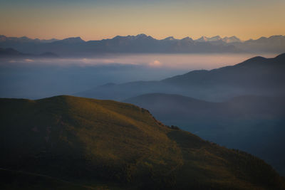 Scenic view of mountains against sky during sunset