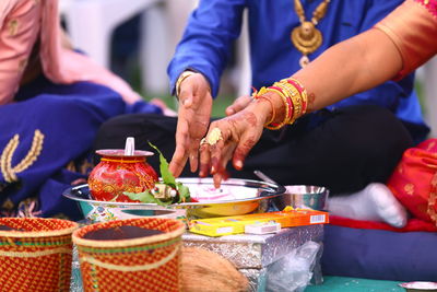 Midsection of people having food