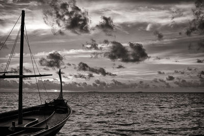 Sailboat sailing on sea against sky