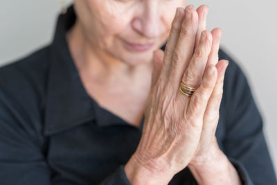 Midsection of woman with hands